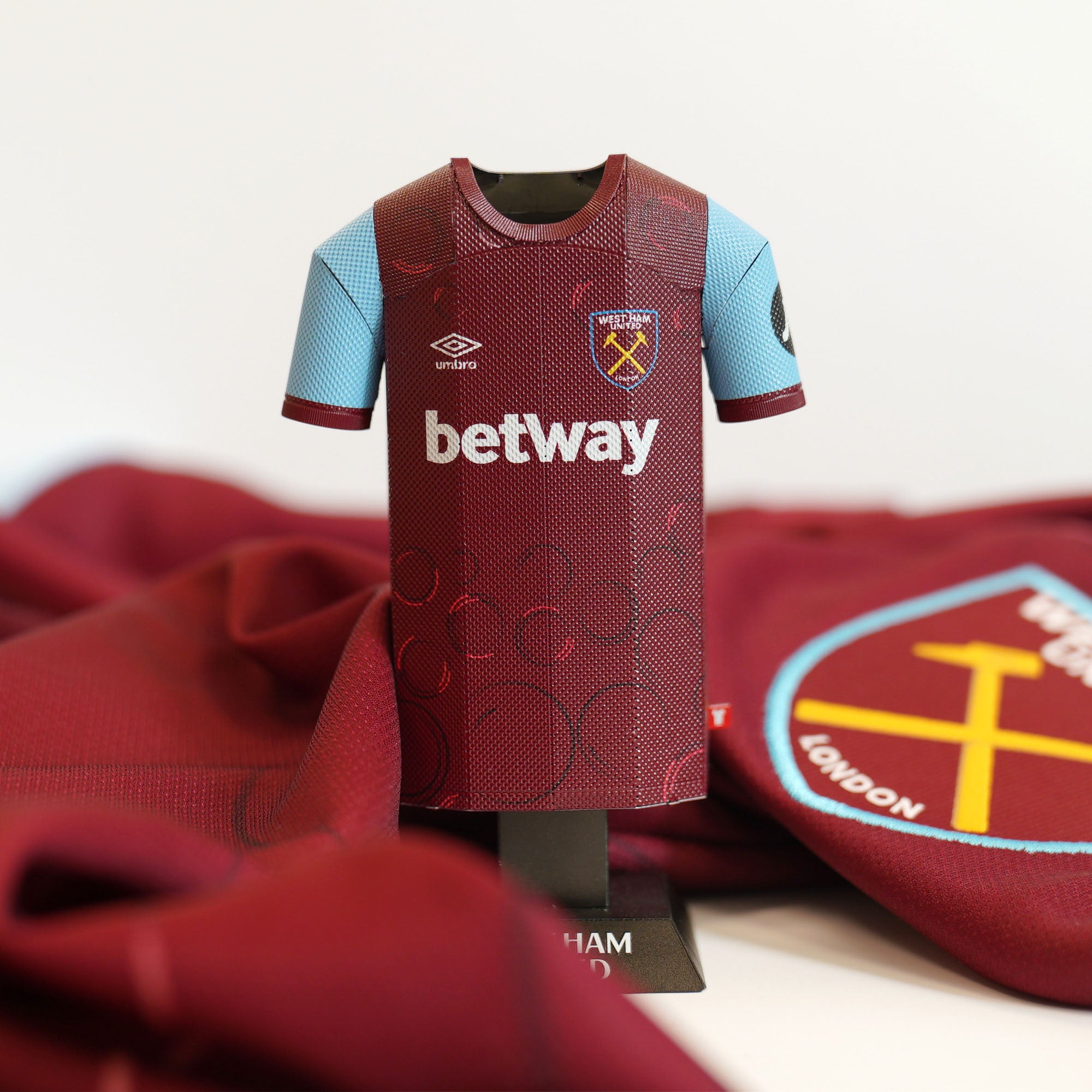 West Ham 23/24 shirt with kit behind it
