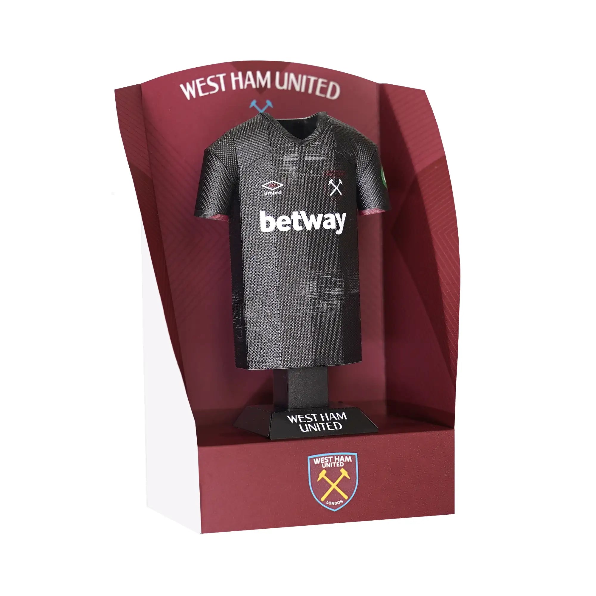 West Ham 24/25 away shirt collectible, made from metal, on display stand.